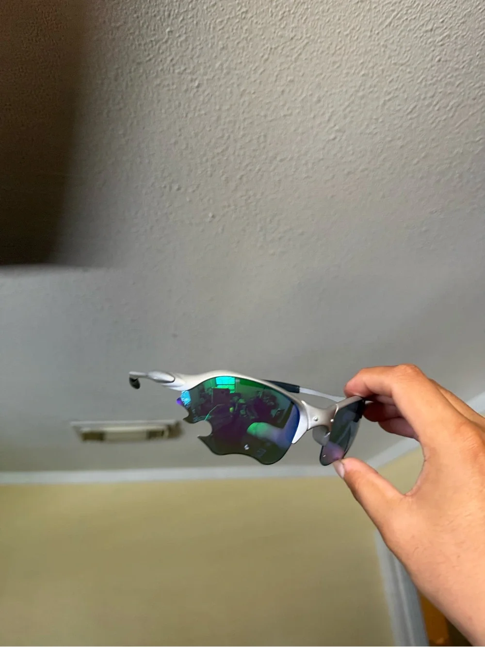 Silver Frame Sunglasses with Iridescent Green Lenses Oakleys